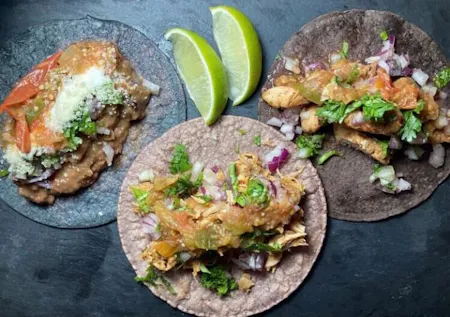 Authentic Mexican tacos and salsa made with 100% corn tortillas