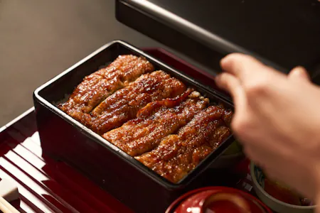 1-day Unagi Kabayaki Lesson at Prestigious Eel restaurant ; --- IZM is a long-established unagi (eel) restaurant located in Nihonbashi, Tokyo. It was founded in **1907**, during the Meiji era, and has been serving traditional grilled eel dishes for over a century. Known for its dedication to authentic Edo-style unagi cuisine, IZM continues to preserve the time-honored techniques and flavors passed down through generations. Location : Mitsukoshimae