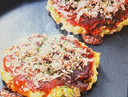 Experience cooking Osaka's famous okonomiyaki and yakisoba