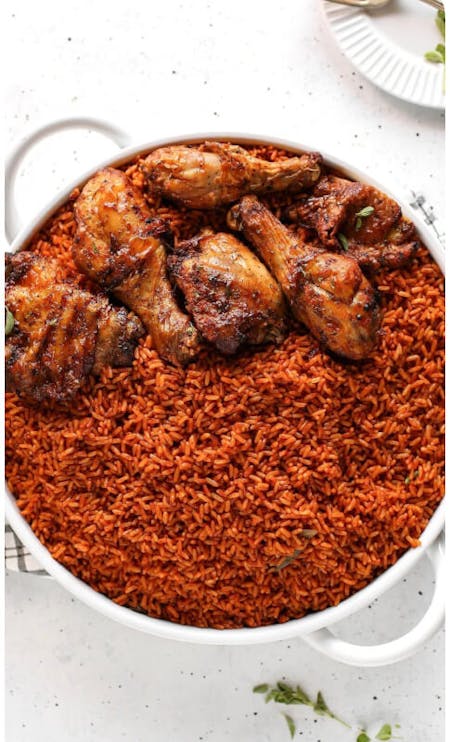 GHANA JOLLOF WITH KELEWELE, A HIBISCUS DRINK (SOBOLO) AND A SIDE PUFF PUFF SNACK