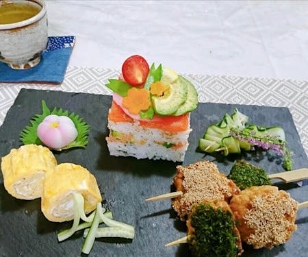 Colorful Oshi Sushi cooking near a Japanese anime character\'s forest
