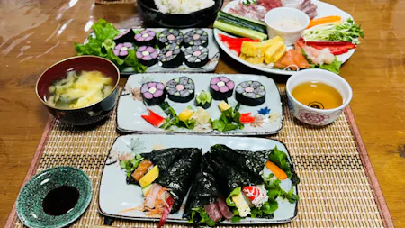 Make two types of sushi rolls and a miso soup. Rice is cooked using a clay pot.